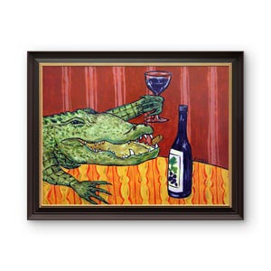 May include: A framed painting depicting a green alligator with an open mouth holding a wine glass in one claw. A blue wine bottle with a grape label sits on an orange patterned tablecloth against a red striped background in this artwork.