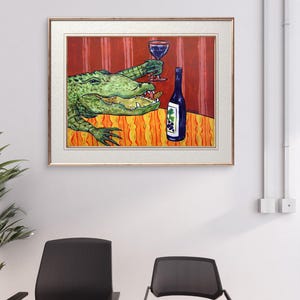 May include: A framed painting depicting a green alligator with an open mouth holding a glass of red wine. Next to the alligator is a dark blue wine bottle with a grape label. The scene is set against a red striped wall and an orange patterned table.