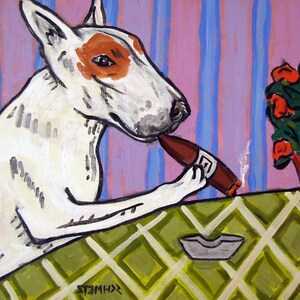 May include: A white and brown bull terrier dog with a red patch on its head is sitting at a table with a green and white checkered tablecloth. The dog is holding a brown cigar in its mouth and there is a white ashtray on the table. There are red roses in the background.