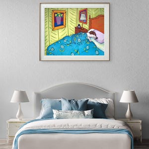 May include: A framed art print depicting a bedroom scene with a dog sleeping under a blue floral patterned blanket. The illustration features a bed with a headboard, a nightstand with a lamp, and a framed picture on a light green wall.