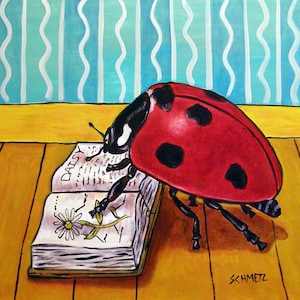 May include: A red ladybug with black spots is perched on an open book with the word "DAISY" printed on the cover. The book has a white page with a drawing of a daisy flower. The background is a blue and white striped wall.