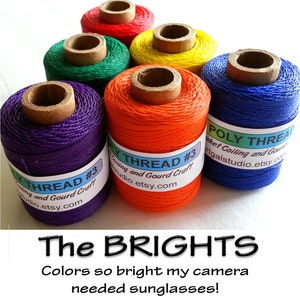 May include: Six spools of colorful thread, each labeled "Poly Thread #3" with the text "Coiling and Gourd Craft" and "studio.etsy.com". The spools are purple, green, yellow, red, orange, and blue.