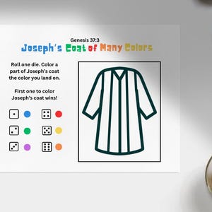 May include: A white paper with the text "Joseph's Coat of Many Colors" and instructions for a coloring game. The game includes a coat outline and dice with color-coded dots. A cup of coffee and a pen are in the background.