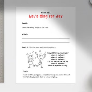 May include: Black and white illustration of two children singing with musical notes above their heads. The text "Let's Sing for Joy" is in red letters. The text "Psalm 95:1" is in black letters. The text "Come, Let's sing for joy to the Lord." is in black letters. The text "Write it." is in black letters. The text "Apply it. Sing the song and color the picture." is in black letters. The text "I've got that joy, joy, joy, joy down in my heart down in my heart down in my heart I've got the joy, joy, joy, joy down in my heart down in my heart to stay." is in black letters. The text "Pray it." is in black letters. The text "Thank God for giving you a voice to worship and praise Him. Ask Him to help you use it daily to bring Him glory." is in black letters.