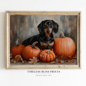 May include: Framed artwork featuring a black and tan dachshund dog surrounded by orange pumpkins and autumn leaves. The dog is the focal point, with a detailed painting style. The artwork is in a rustic, gold-toned frame. The text "TIMELESS BLISS PRINTS" is at the bottom.