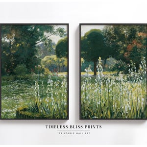May include: A set of two printable wall art prints featuring a landscape painting of a lush green forest with white flowers in the foreground. The prints are framed in black.