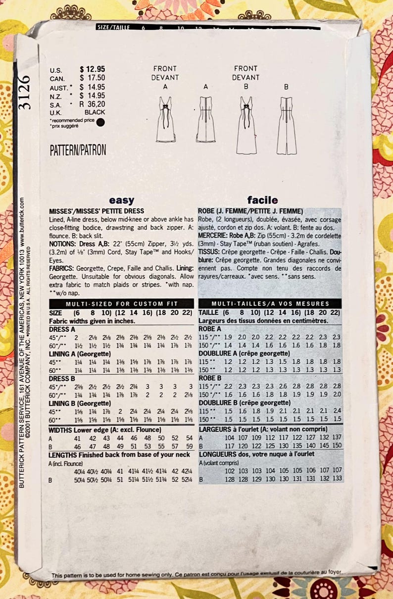 Op de afbeelding: Een naaipatroon voor een dames- of dames-petite jurk, met een A-lijn, nauwsluitend lijfje en ritssluiting aan de achterkant. Bevat stofbreedtematen in centimeters voor verschillende maten.