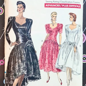May include: Vogue Patterns sewing pattern featuring three dress designs. The pattern includes a black dress with a lace skirt, a pink dress, and a white dress with a bow. The pattern is rated as advanced.