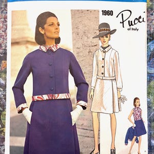 May include: A vintage Vogue Couturier Design fashion illustration from 1960, featuring designs by Pucci of Italy. The image showcases three women in stylish outfits, including a purple dress with a patterned belt and cuffs. The text "Vogue Couturier Design" is at the top.