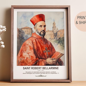 May include: Framed watercolor print of Saint Robert Bellarmine, a cardinal, wearing a red robe and hat, holding a book. The print includes text identifying him as the patron of catechists and canon lawyers. The background shows a European cityscape.