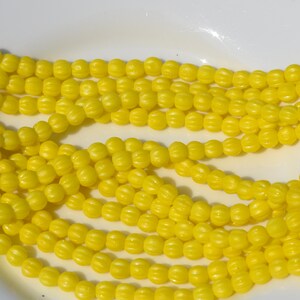 Yelloe brillante 5mm melón cristal checo perlas 50