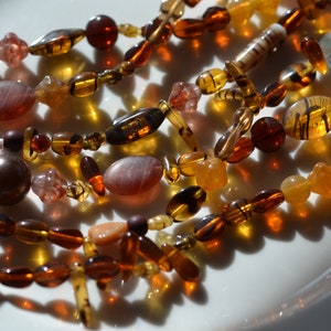 Mega Tortoise Amber Bead Mix Fio Longo