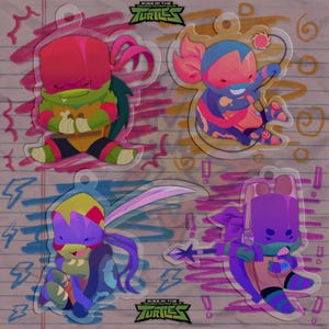 May include: Four cartoon character keychains from the Rise of the Teenage Mutant Ninja Turtles series. Each keychain features a different character in vibrant colors, with a clear, glossy finish. The background is a lined paper design with doodles and the show's logo.