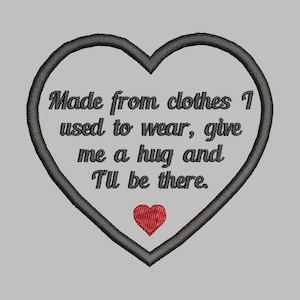 May include: A gray heart-shaped patch with the text "Made from clothes I used to wear, give me a hug and I'll be there."  A small red heart is in the center of the patch.
