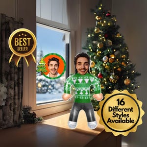 May include: An inflatable Christmas decoration featuring a person's face, wearing a green sweater with a white Christmas tree pattern, black pants, and white socks. The image includes a "Best Seller" badge and a badge that says "16 Different Styles Available."