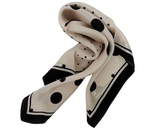 May include: A beige silk scarf with a black polka dot pattern and a black border.