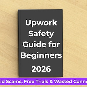 May include: A black book titled "Upwork Safety Guide for Beginners 2026" with white text. Below the book is a purple banner with the text "Avoid Scams, Free Trials & Wasted Connects". The book is on a light brown wooden surface.