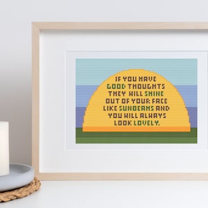 以下が含まれることがあります： 黄色い太陽と緑の草が描かれた額縁付きのクロスステッチデザイン。テキストには「良い考えがあれば、それは太陽の光のようにあなたの顔から輝き、あなたはいつも美しく見えるでしょう。」と書いてあります。