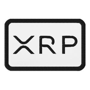 May include: Black and white embroidered patch with the word "XRP" in a white rectangle with a black border.