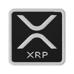 May include: A black and white embroidered patch with the XRP logo and the word "XRP" in white.