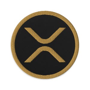 May include: A gold embroidered patch with a black background and a stylized "X" design.