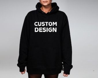 May include: Black hooded sweatshirt with the text "CUSTOM DESIGN" printed in white on the front.