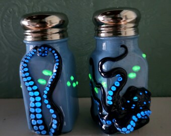 Black and Blue Kraken with Phosphorescent Accents Sculpted with Polymer Clay onto Salt and Pepper Shakers in Periwinkle Blue