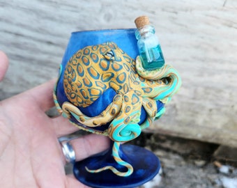 Octopus Catches a Wave Sculpted with Polymer Clay onto a Recycled Glass Candle Holder in Deep Blue with Phosphorescent Accents