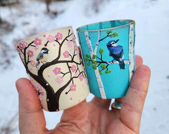 A Chickadee in Spring and a Blue Jay in Summer Sculpted with Polymer Clay onto a Set of Two Recycled Glass Candle Holders