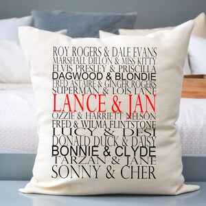 May include: White pillow with black text listing famous couples' names, including "Lance & Jan" in red text.