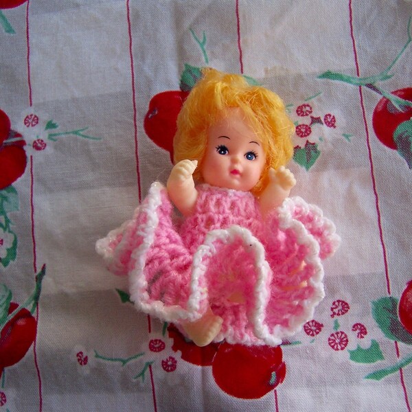 doll / plastic doll with knitted dress