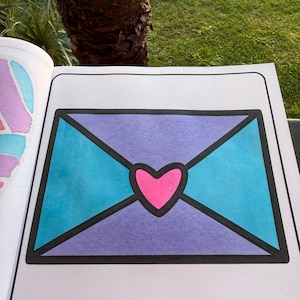 May include: A purple and blue envelope with a pink heart in the center. The envelope is outlined in black.