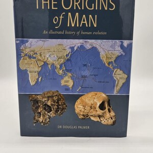The Origins of Man: An Illustrated History of Human Evolution - Hardcover - GOOD