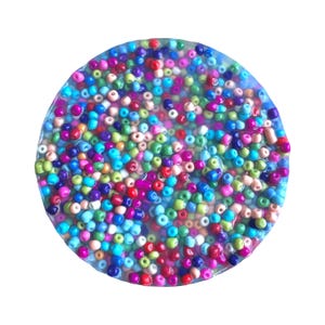 May include: A circular, clear resin coaster filled with a multitude of small, colorful beads. The beads are in shades of red, pink, blue, green, yellow, and purple. The coaster has a slightly irregular edge and sits against a white background.