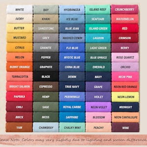 May include: A color chart featuring a grid of rectangular fabric swatches in various shades. Each swatch is labeled with its corresponding color name, including white, khaki, blue jean, island reef, crunchberry, mustard, and many other distinct hues.