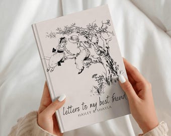 May include: A light-colored hardcover book with a black ink illustration of two figures sitting on a tree branch. The cover features the text "Letters to my best friend" followed by the names "HAILEY & SHAYLA" in a simple, dark font.