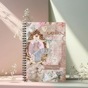 May include: A pink and brown spiral bound notebook with a vintage aesthetic. The cover features a collage of images including a woman in a blue dress, a fan, a teapot, and flowers. The text "CHARLOTTE" is printed on the cover.
