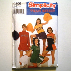 May include: Simplicity sewing pattern number 9806 for making cheerleading uniforms. The pattern includes four different designs with the words "Stars", "Devils", "Tigers", and "Varsity" on the uniforms. The pattern is for sizes D (20-24) and 4-6.