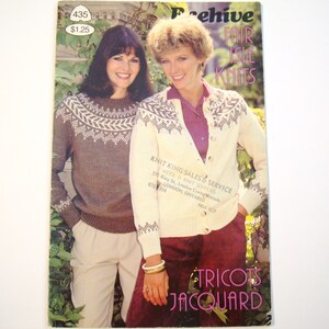 May include: A vintage magazine cover showcasing two women in Fair Isle knitwear. The cover displays the text "Archive Fair Isle Knits" and "Tricots Jacquard". The magazine's price is indicated as £1.25. The cover also features a knitwear supplier's details.