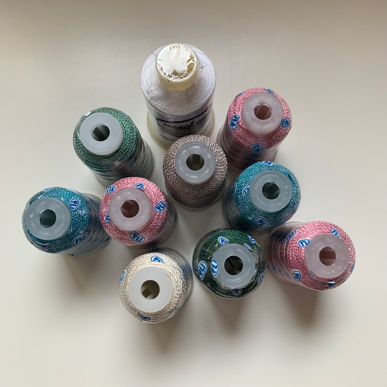 10 spools of thread in various colours - 9 YLI Pearl Crown Rayon and 1 Marathon Viscose Rayon Filament