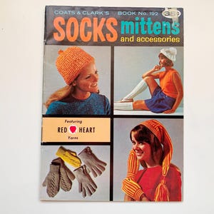 May include: A vintage magazine cover showcasing knitted socks, mittens, and accessories. The cover features images of women wearing knitted hats, socks, and mittens. The text includes "COATS & CLARK'S" and "RED HEART Yarns".