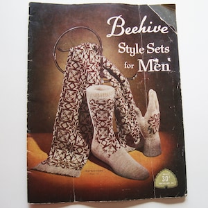 May include: A vintage Beehive Style Sets for Men knitting pattern booklet featuring a maroon and cream patterned scarf, a matching sock, and a glove. The cover displays the title text, instructions page reference, and a price tag of 30 cents.