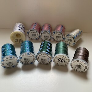 10 spools of thread in various colours - 9 YLI Pearl Crown Rayon and 1 Marathon Viscose Rayon Filament