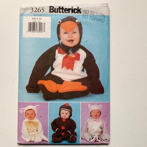 May include: A sewing pattern for a penguin, lamb, and gingerbread baby costume. The pattern is from Butterick and has the number 3265. The pattern is for sizes NB-SM.