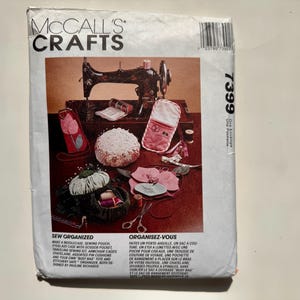 May include: A McCall's Crafts sewing pattern envelope. The front shows a sewing machine, pincushions, and sewing accessories. The text reads "Sew Organized" and includes instructions for various sewing projects.