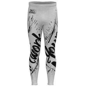 May include: Gray leggings with a black graphic print of the word "work" on the left leg and the word "hard" on the right leg.
