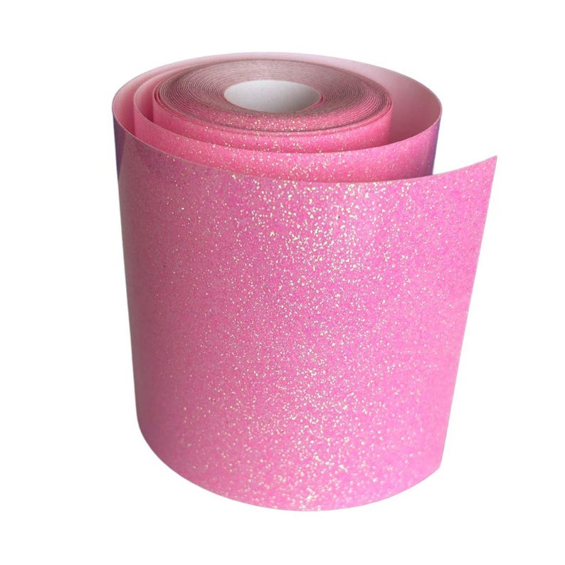 May include: A roll of pink glitter tape, unrolled to show the sparkly texture. The tape is a vibrant shade of pink with a shiny, glittery surface, perfect for crafts and decorations.