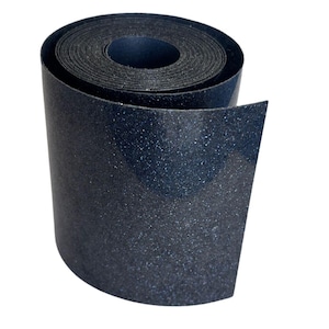 May include: A roll of dark blue, textured material with a glittery appearance. The material is tightly wound, revealing the inner layers. The edges of the roll are visible, and the background is plain white.