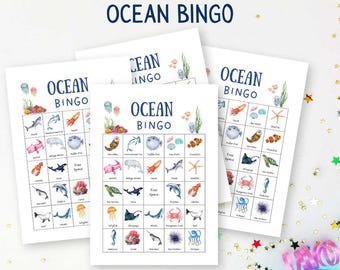 May include: Four white printable "Ocean Bingo" game sheets. Each sheet features a grid of colorful sea creatures, including sharks, fish, and starfish. The title "Ocean Bingo" is at the top, with the text "Printable PDF Instant Download" above it. The words "Joyful Munchkin" are at the bottom.
