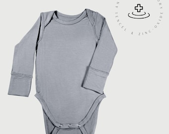 Body de manga larga para bebé: tejido Tencel con óxido de zinc para pieles sensibles.